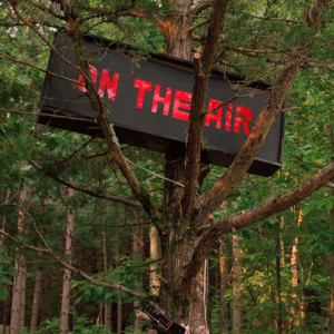 Picture of On Air sign in tree to depict Wave Farm